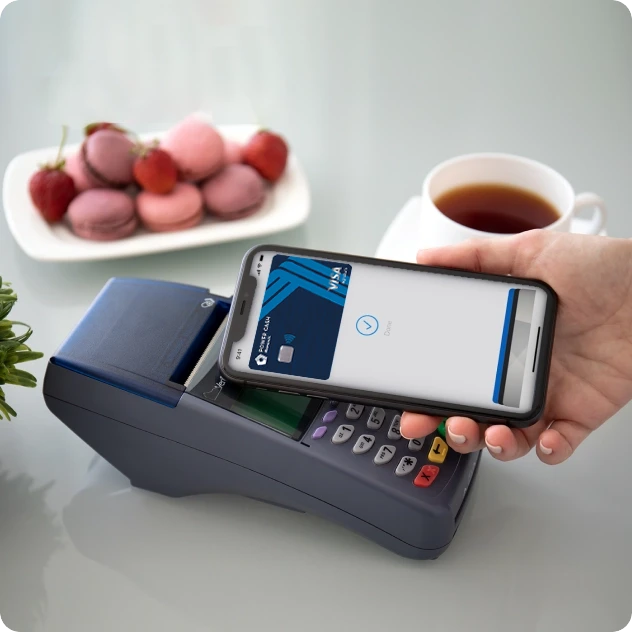 Mobile phone making a contactless payment with a credit card payment terminal