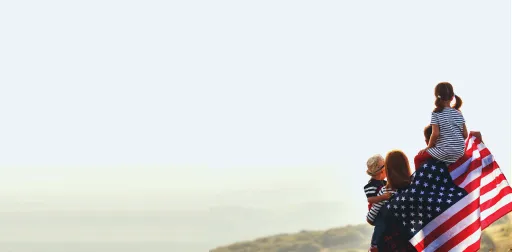Family holding the American flag expressing their patriotism