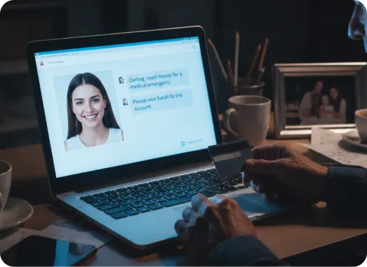 scammer viewing identity of a women on laptop