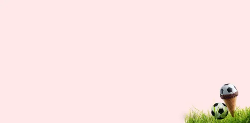 A soccer ball scoop of ice cream in a waffle cone with chocolate sprinkles next to a small soccer ball in the grass against a pink background.