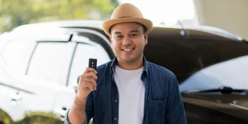 man holding a new car key