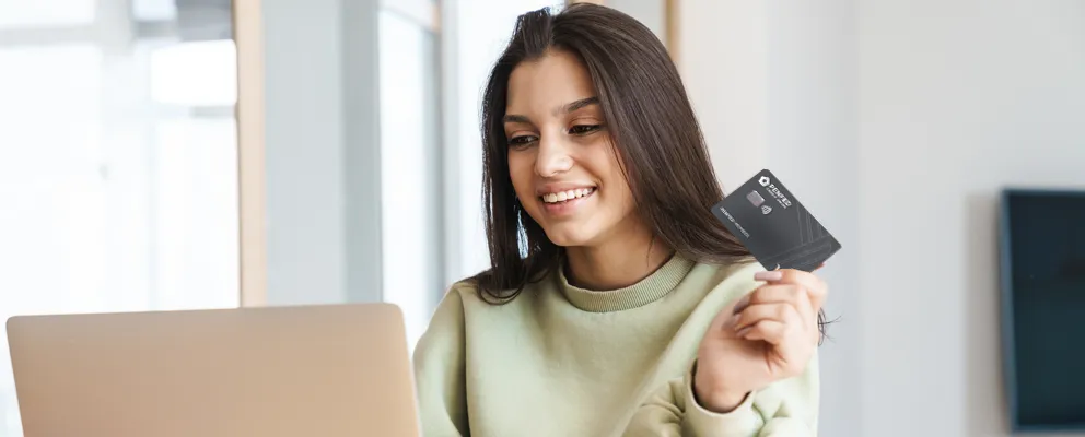 A lady holding a penfed card