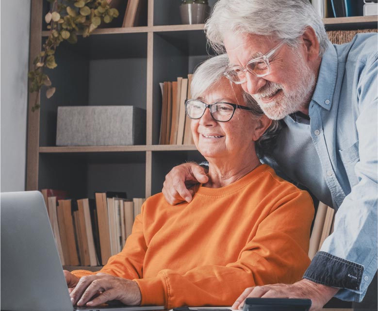 Man and woman looking at laptop