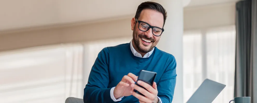 a person interacting with his mobile phone