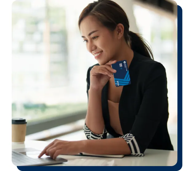 A girl holding a power cash rewards visa card