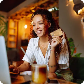 woman making a payment with her PenFed Gold Card