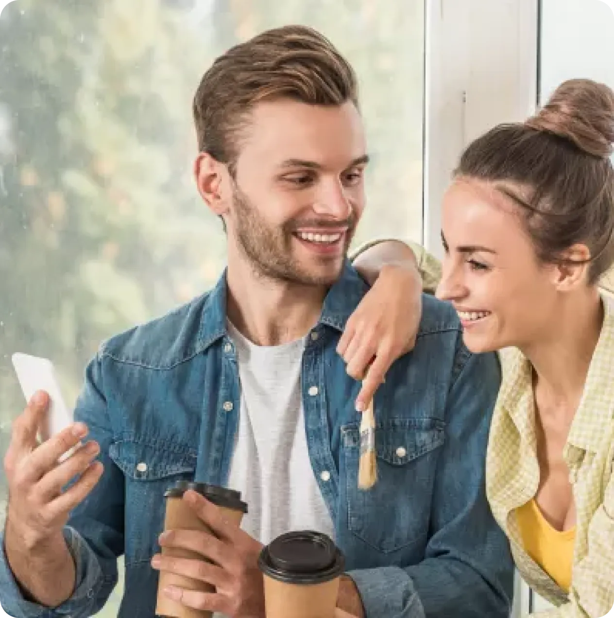 young couple smiling and interacting with one another