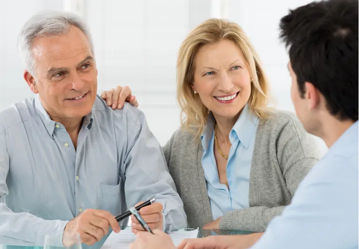 An old couple interacting with a man