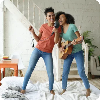 Two girls singing and enjoying