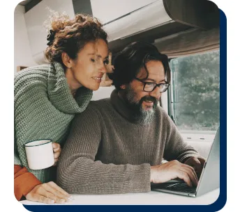 a couple working on a laptop