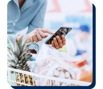 mobile phone on top of a shopping cart