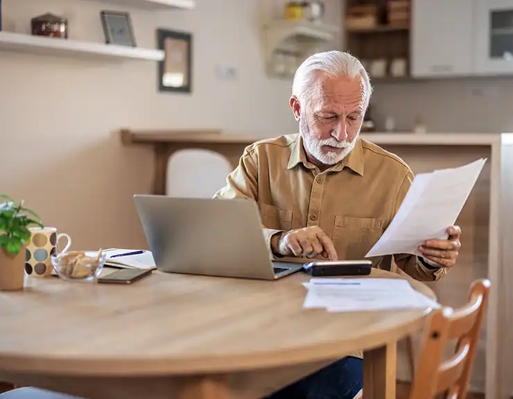 man calculating expenses