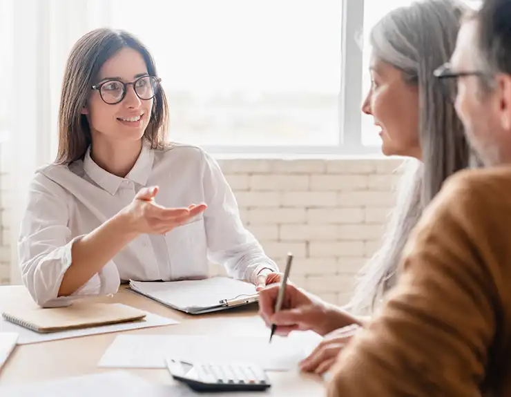 couple speaking with loan officer