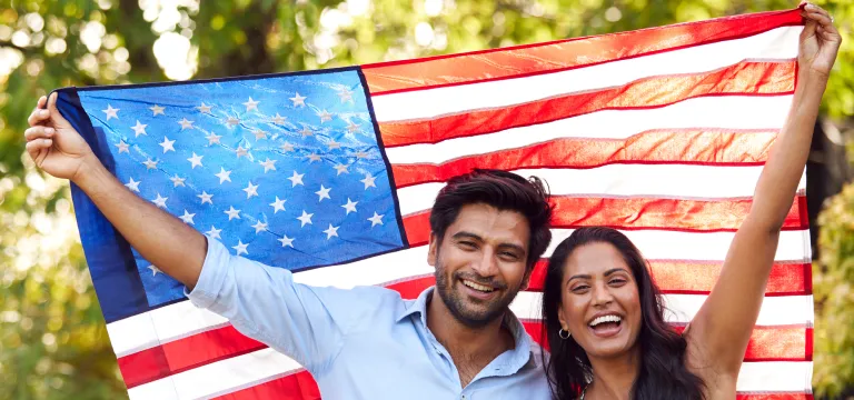 Couple waving the American flag together