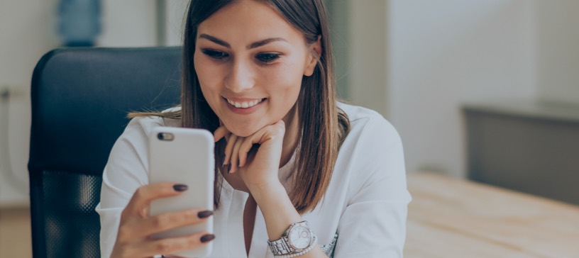 woman looking into a mobile