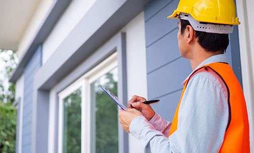 home inspector reviewing checklist