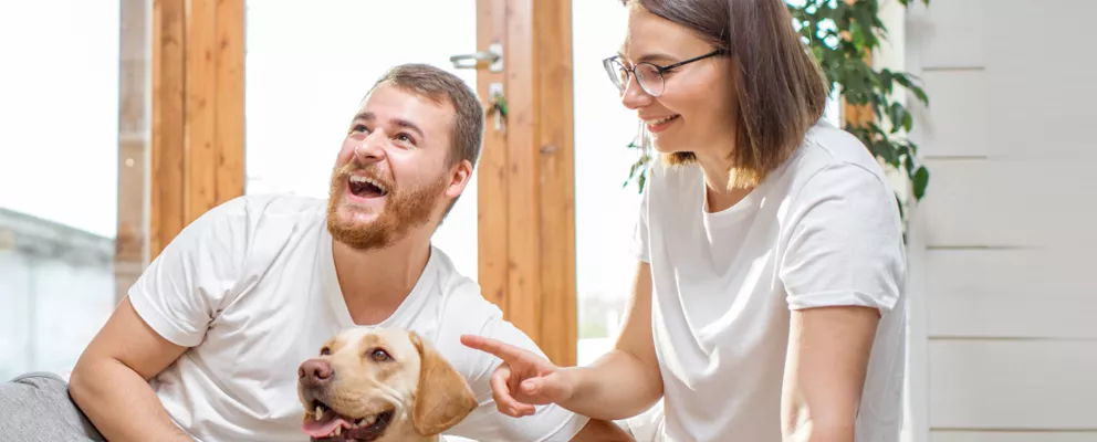 couple with their pet dog