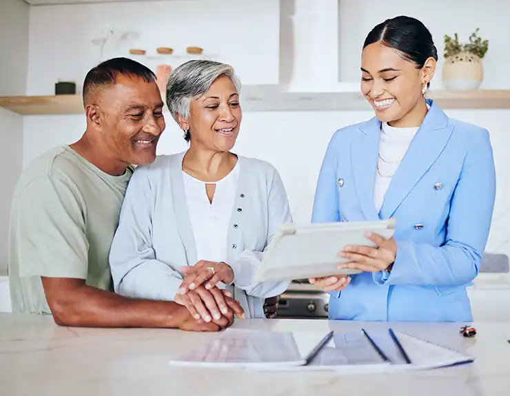 couple speaking with real estate agent