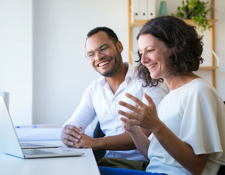 couple researching on computer
