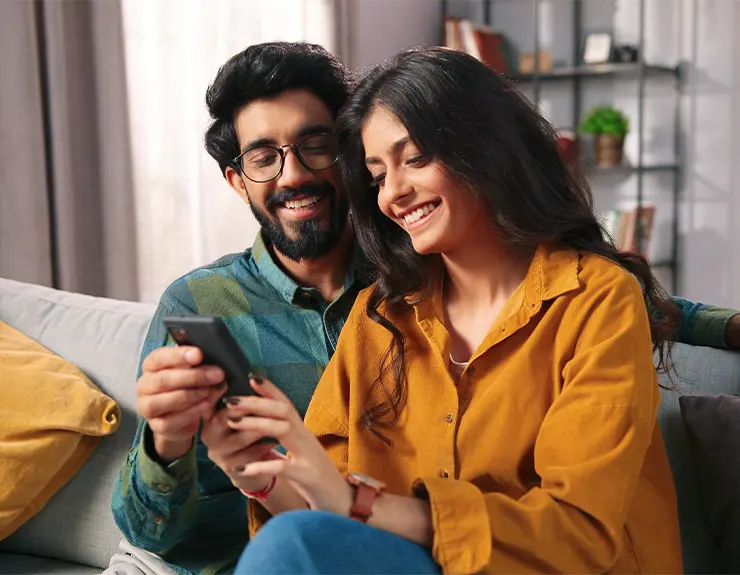 couple reviewing options on the phone