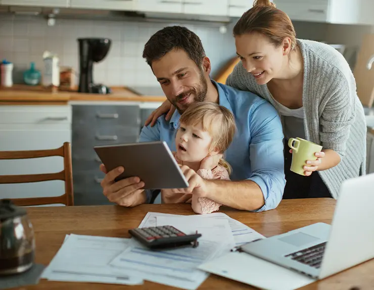 family doing research at the kitchen table
