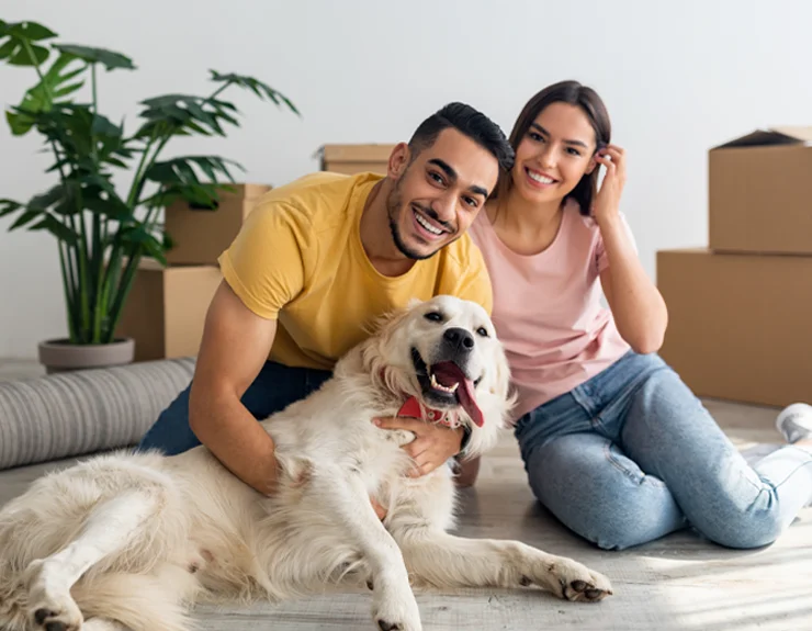 couple moving into new home with their dog