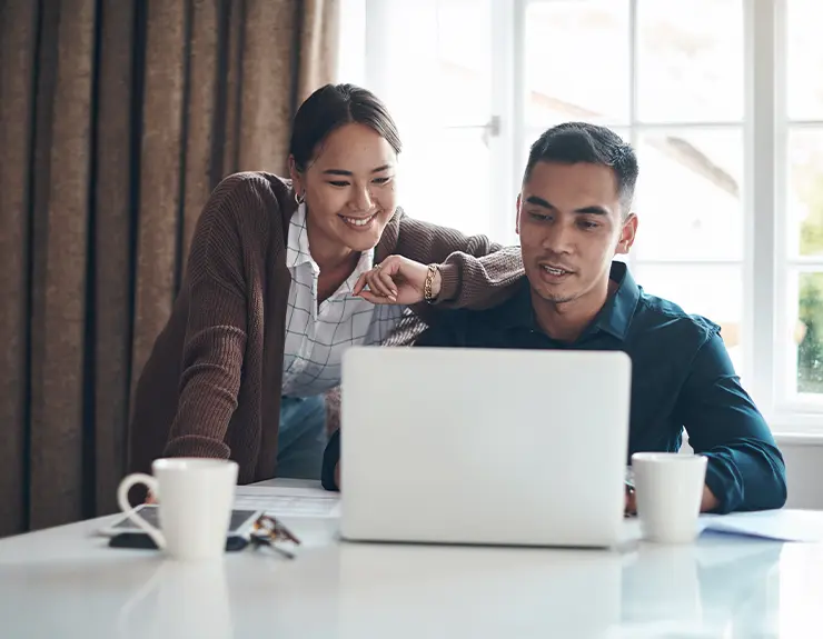 couple doing research on the computer