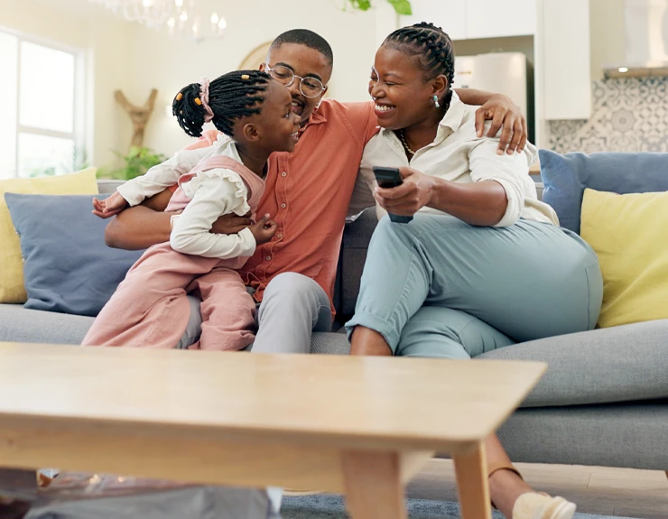 family having fun on the couch