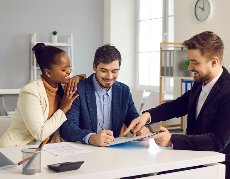 couple talking to real estate agent