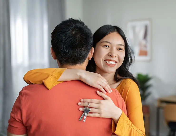 happy couple in new home