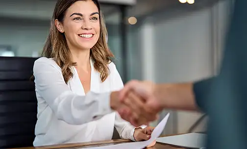 women having a hand-shake