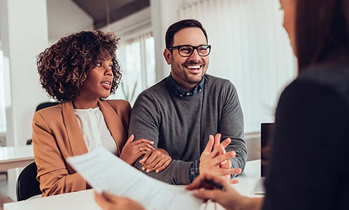 couple speaking to loan officer