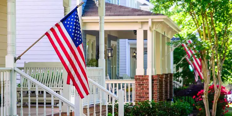 House with American flag on porch