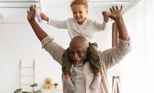 grandfather playing with kids