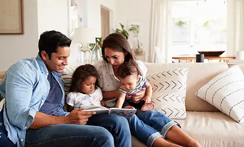 family reading a book