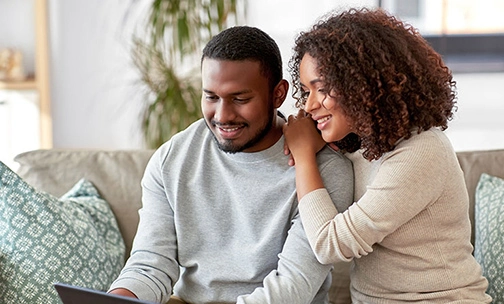 couple looking at tablet