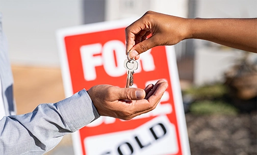 person receiving keys to new home