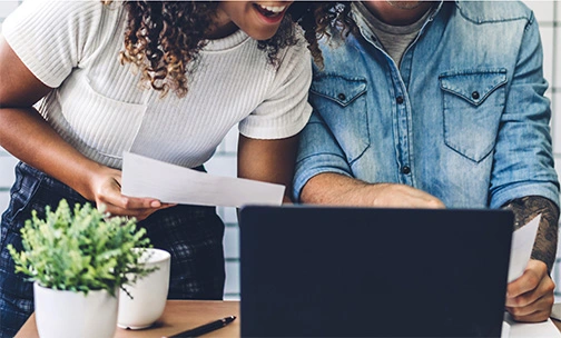 couple comparing mortgages on computer