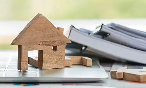 wooden house on top of computer