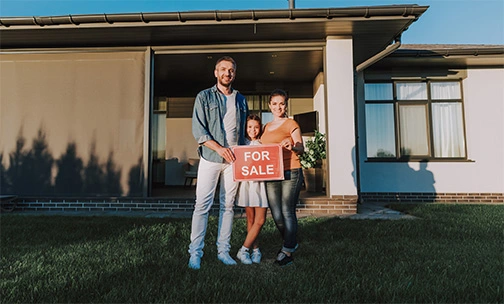 couple in front of their home