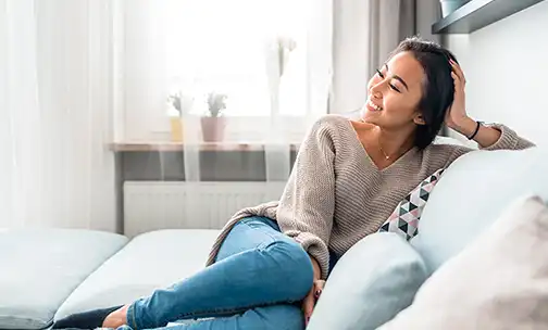 Lady relaxes on a couch