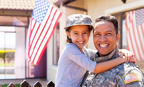 Military Personnel united with a kid