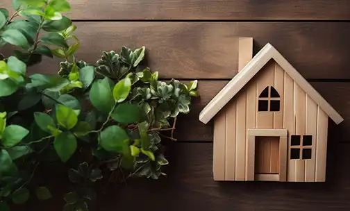Wooden house miniature hanging on the wooden panel
