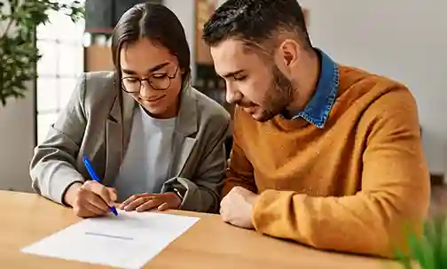 Couple discussing over the paperwork