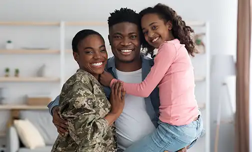Woman in military uniform with her family at home