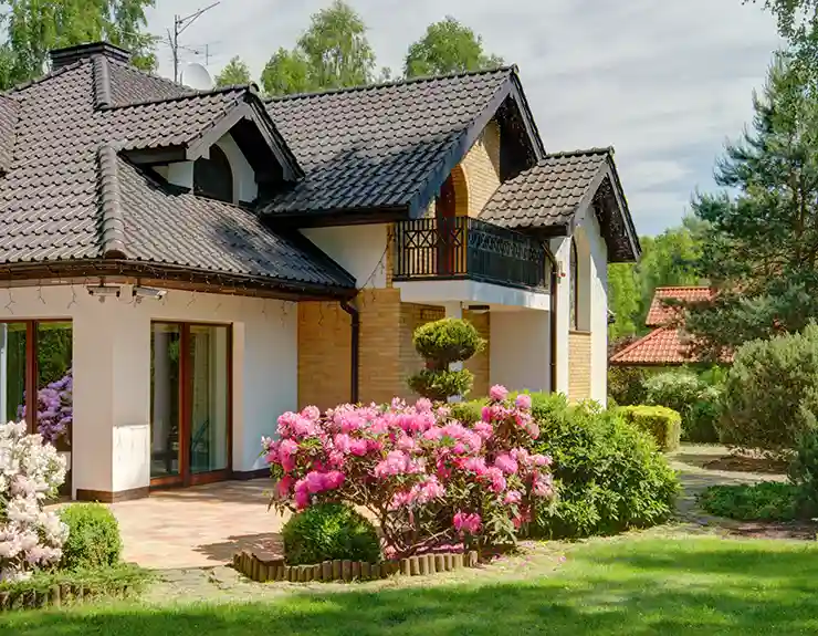 home with flowers in front