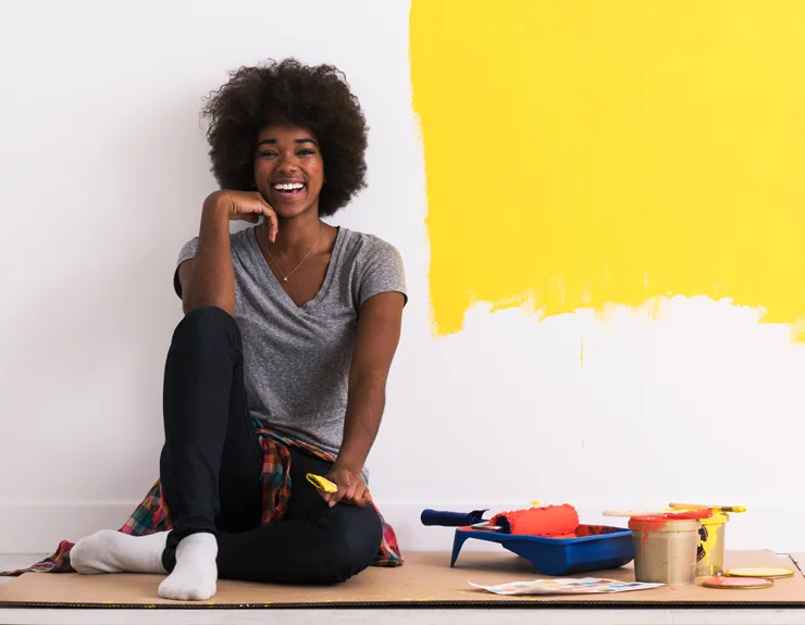 woman painting her home