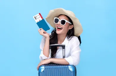Travelling women with Carry-on luggage and boarding passes in hand.